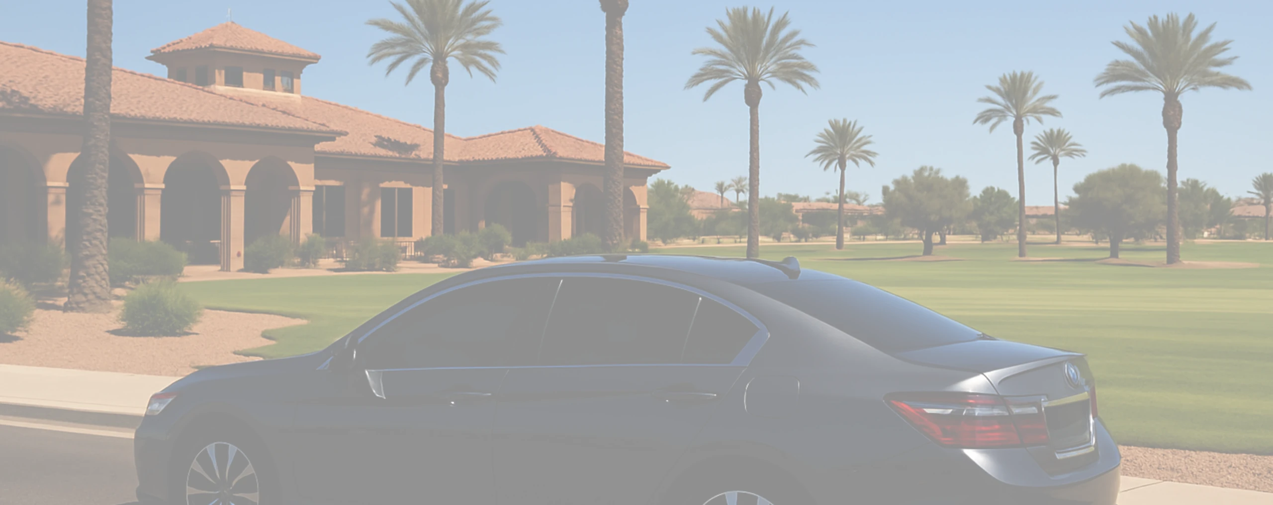 a car in front of a golf course