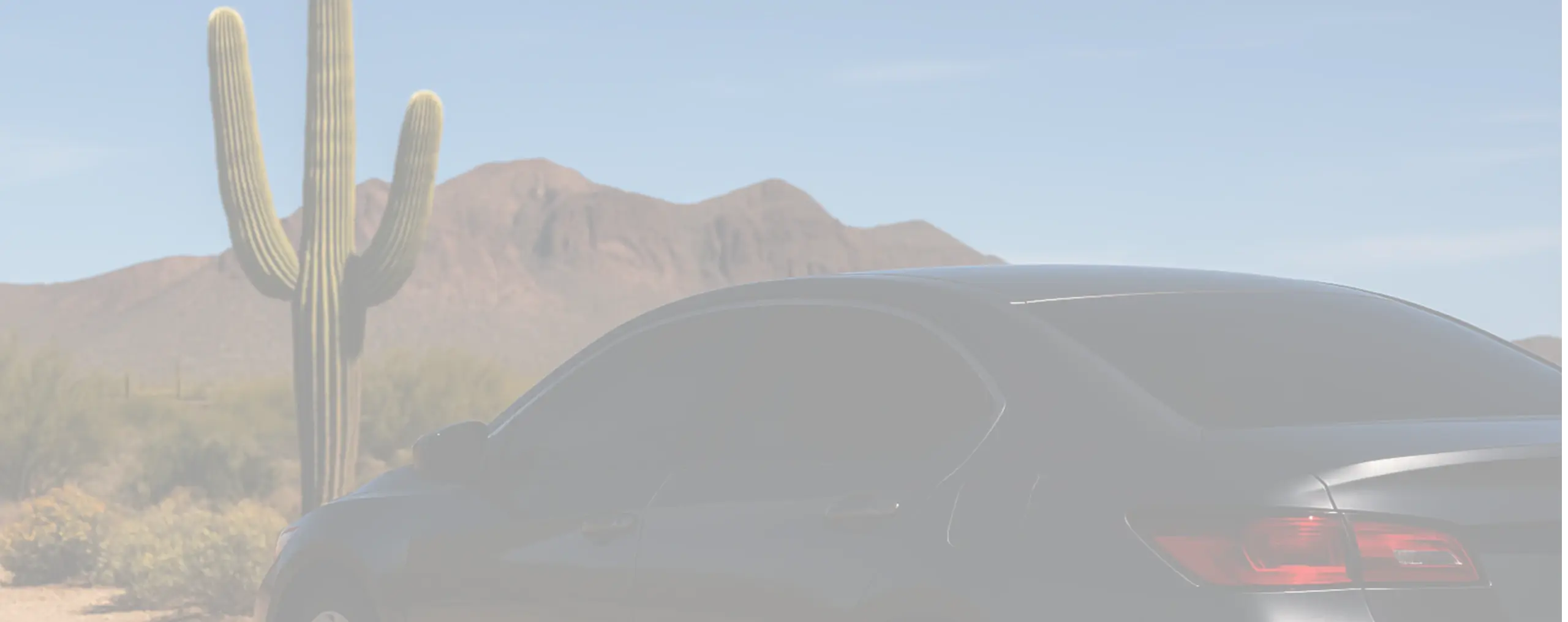 a car next to a mountain