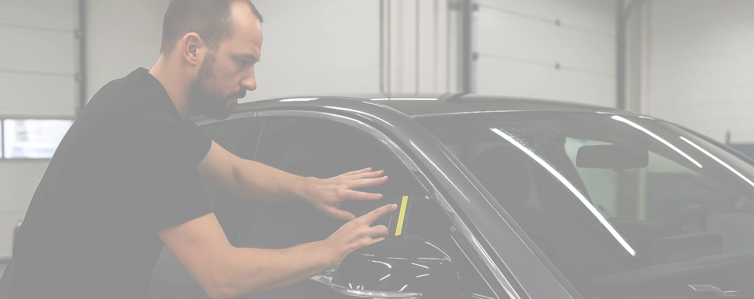 Person tinting a car