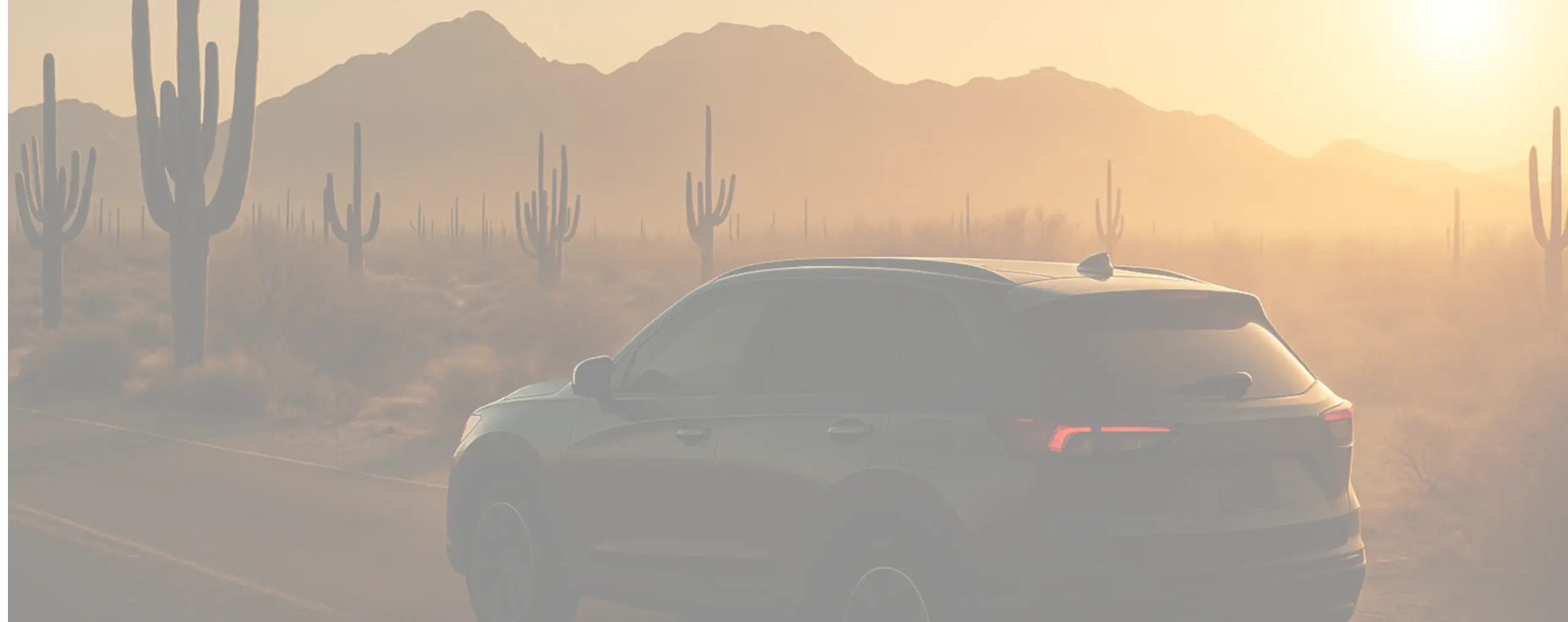 A car driving on a desert road