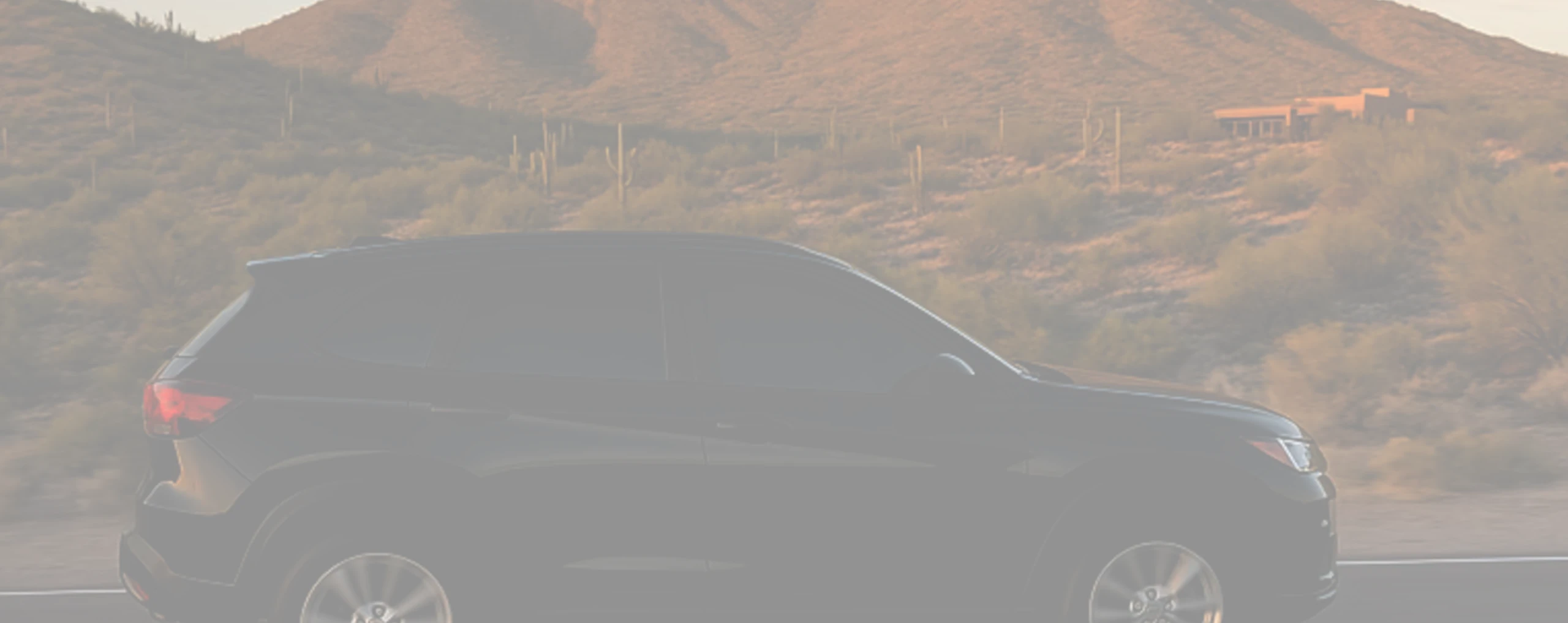 A tinted car driving in Buckeye