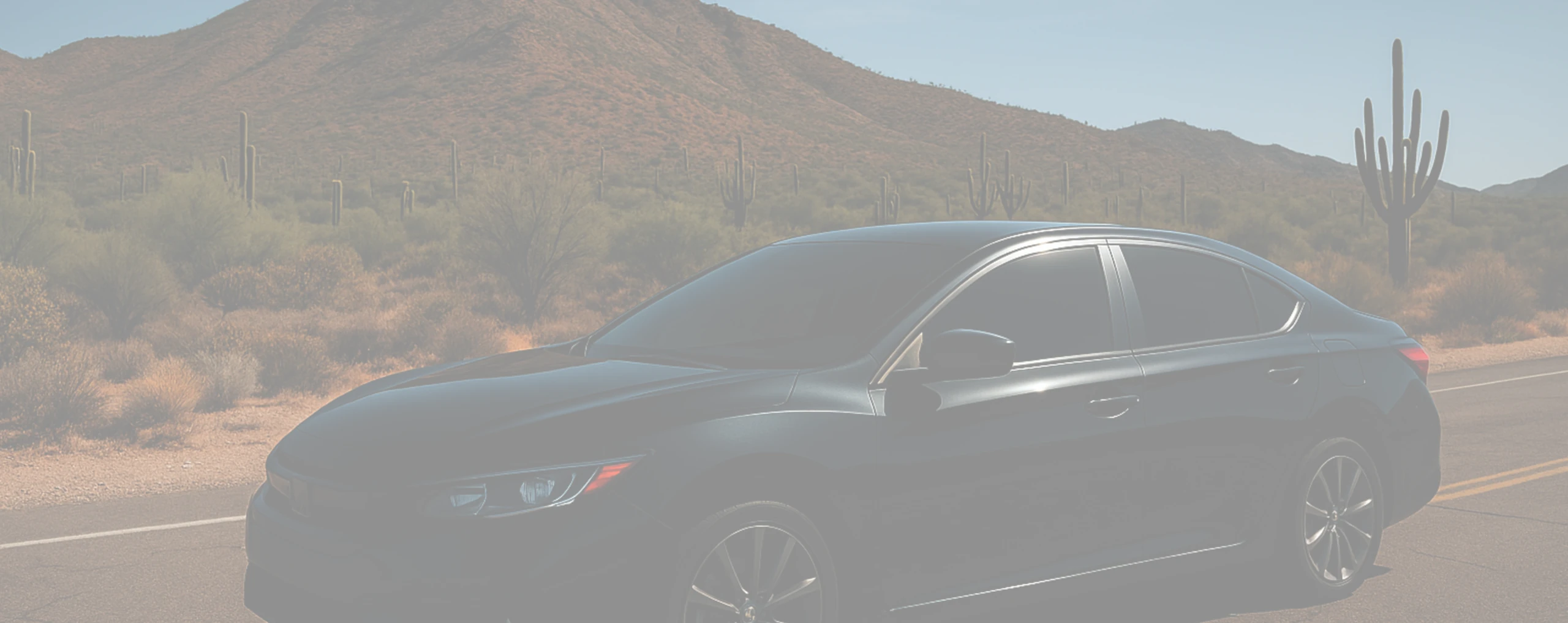 a vehicle with tint next to mountain