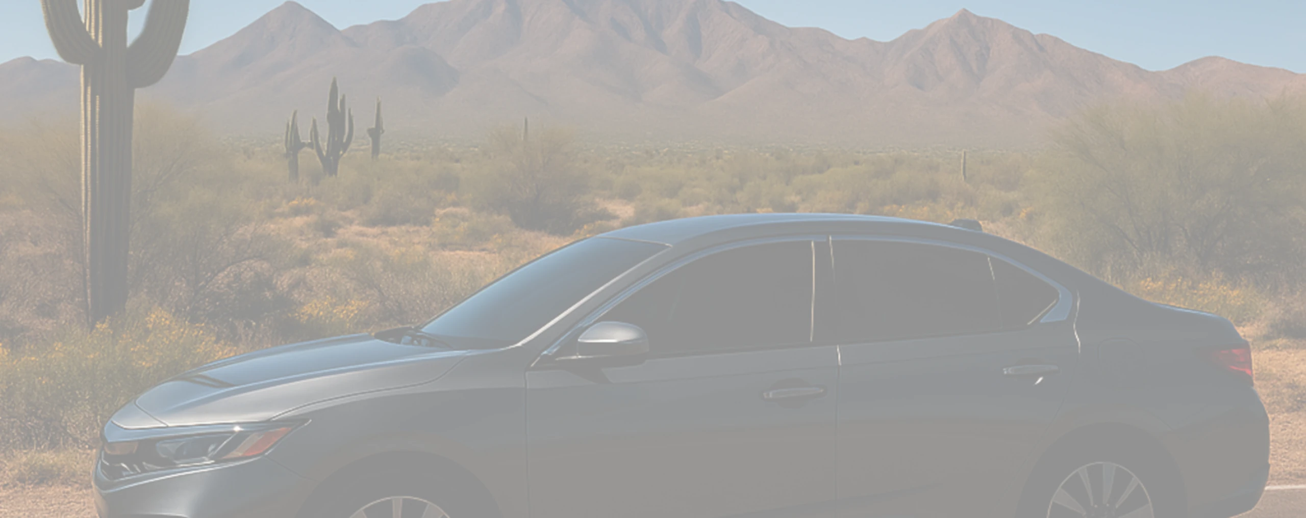 a car with window tint on a desert road