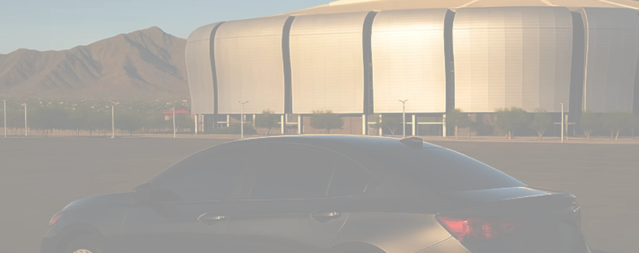 a tinted car sitting infront of a stadium in glendale