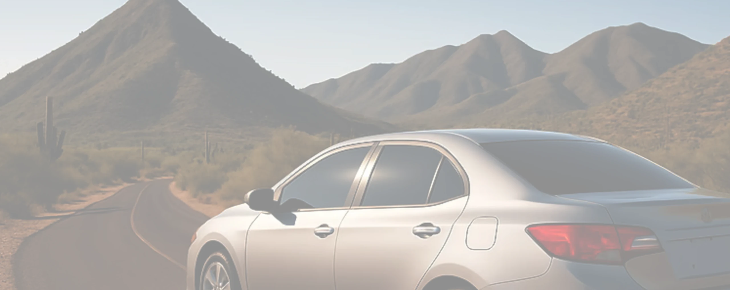 a tinted car on a scenic drive