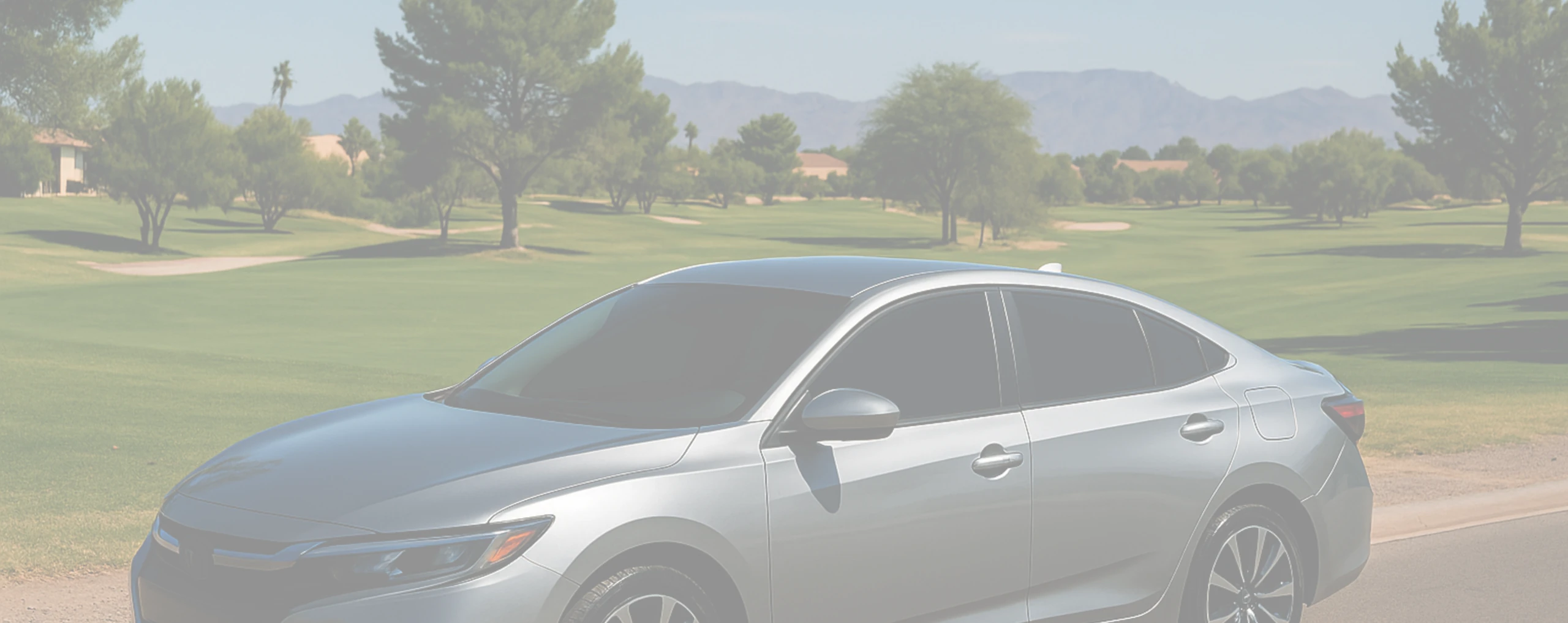 a car next to a golf course