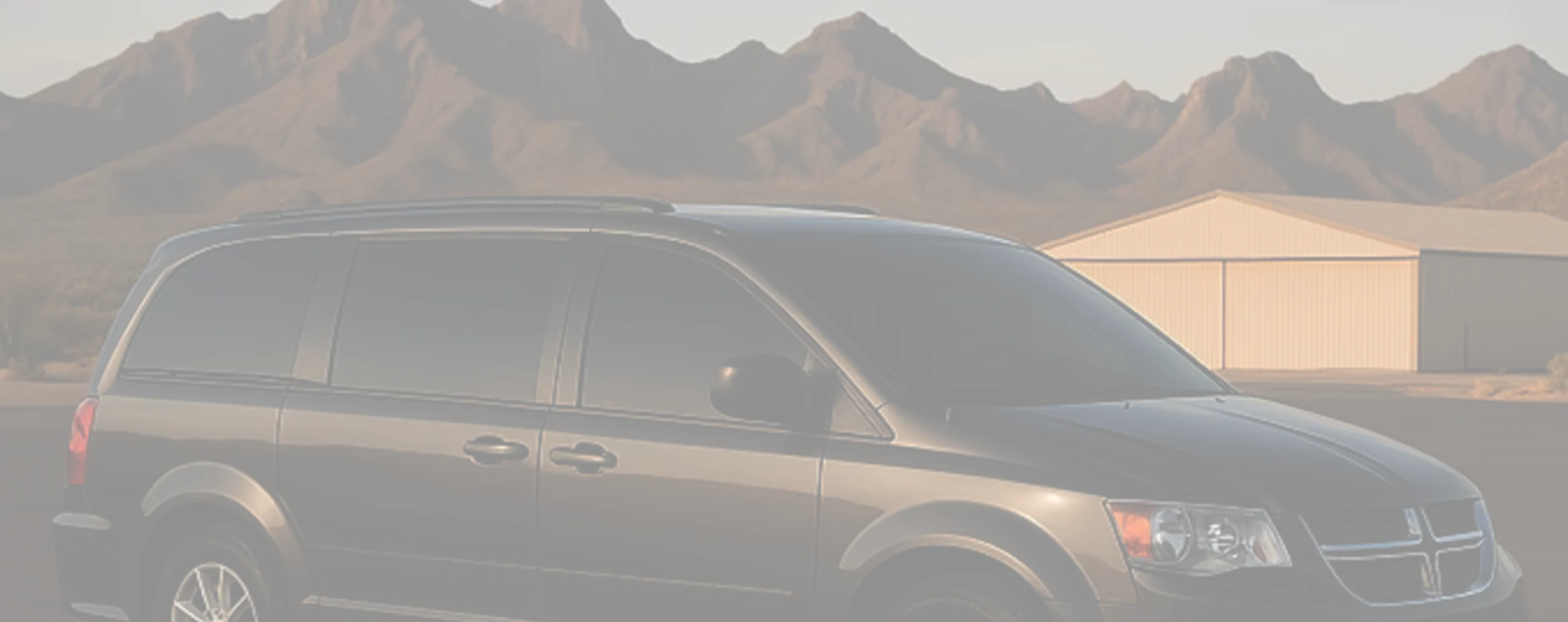 a tinted car in front of an airport in valencia west