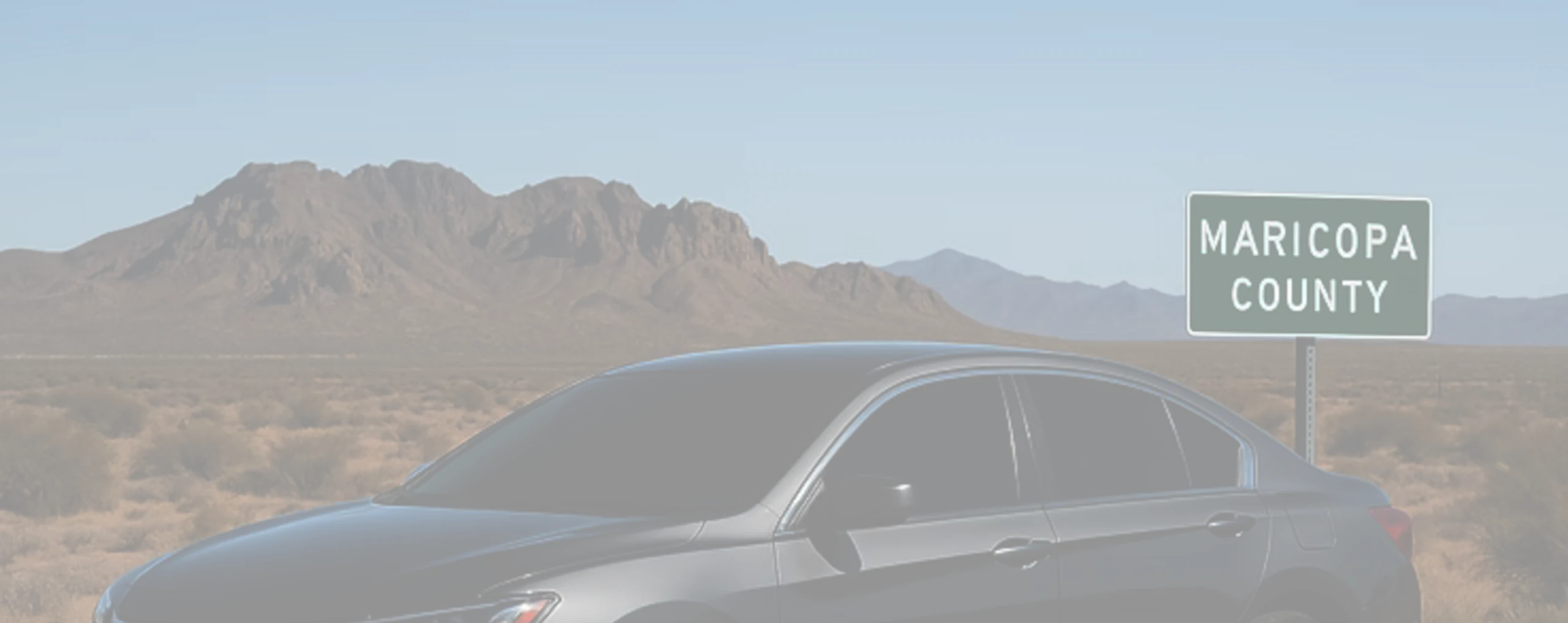 a tinted car next to a mountain in wittmann