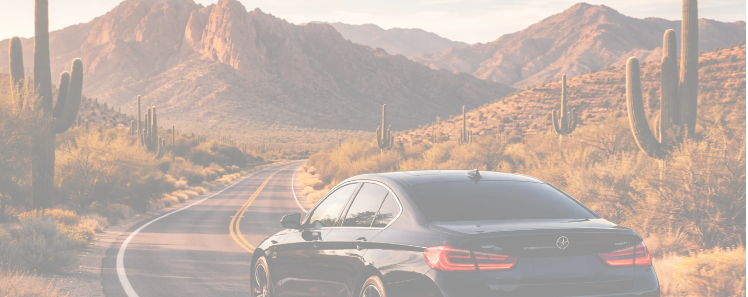 a luxury car with auto window tint driving through tucson az