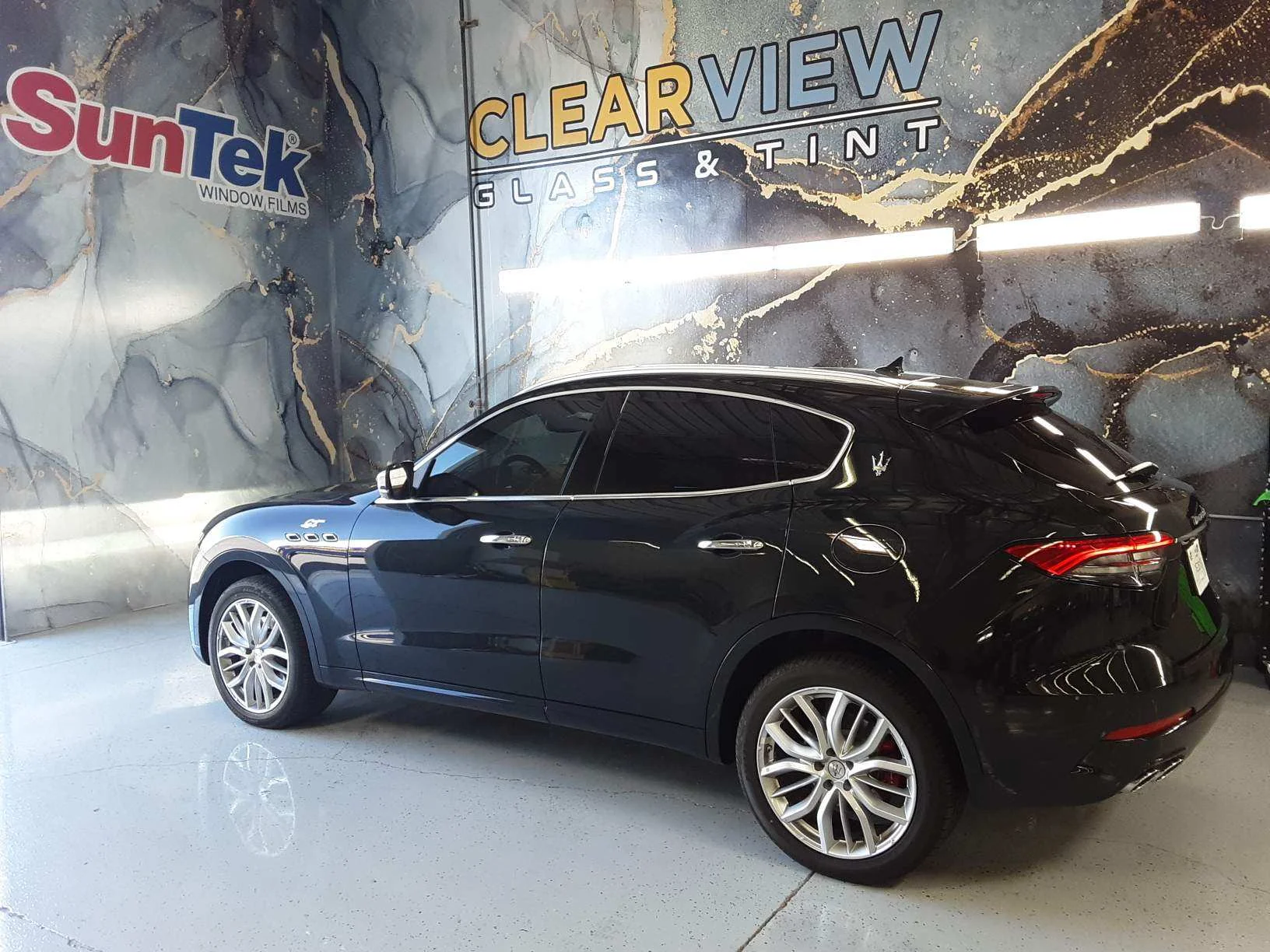 Completed window tint job on a black Maserati Levante SUV at Clear View Glass & Tint in Tucson, Arizona, featuring SunTek window film