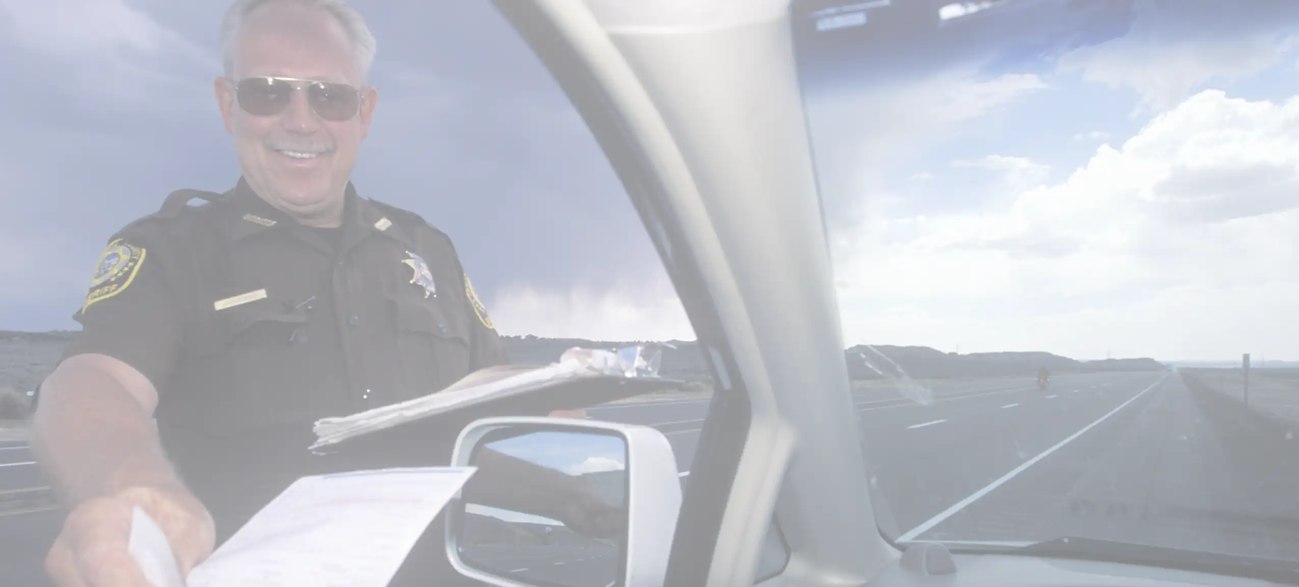 a driver receiving a window tint ticket